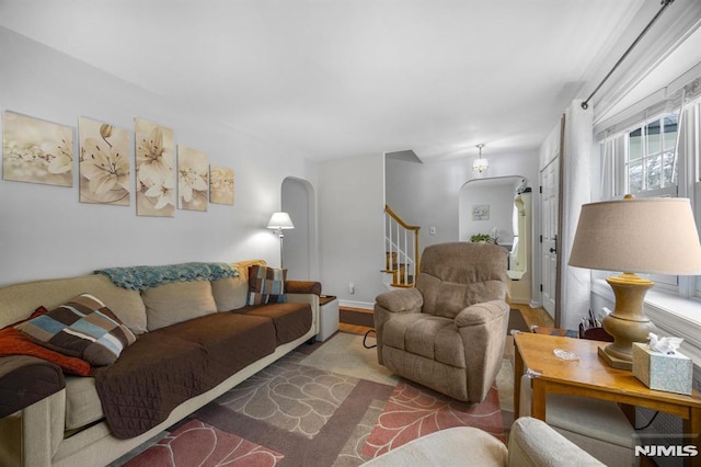 101 Pasadena Pl, Hawthorne, NJ 07506 - living area featuring arched walkways, stairs, and wood finished floors