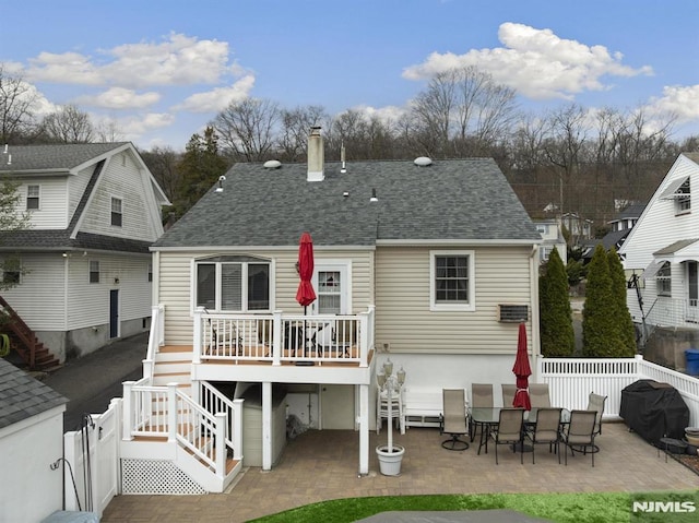 101 Pasadena Pl, Hawthorne, NJ 07506 - rear view of house with stairs, a patio, roof with shingles, and a chimney