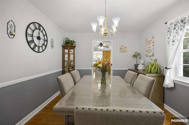 101 Pasadena Pl, Hawthorne, NJ 07506 - dining area featuring a chandelier, wood finished floors, and baseboards