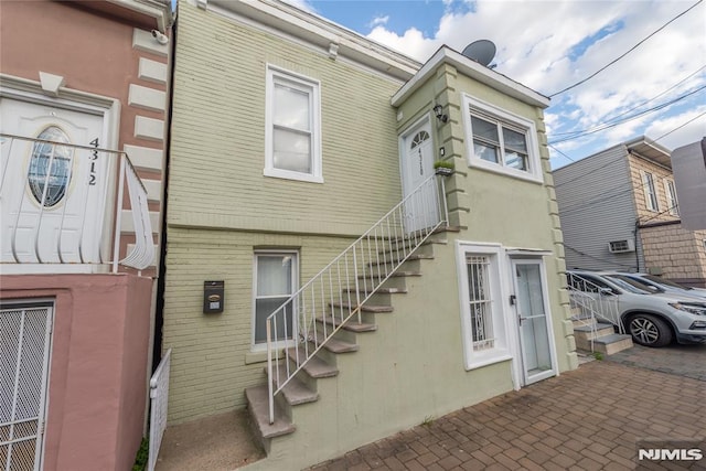 4310 Newkirk Ave, North Bergen, NJ 07047 - back of house with stairway and brick siding