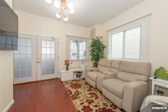4310 Newkirk Ave, North Bergen, NJ 07047 - living room with ornamental molding, a chandelier, wood finished floors, and french doors