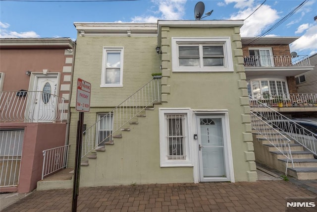 4310 Newkirk Ave, North Bergen, NJ 07047 - rear view of property with stairway and stucco siding
