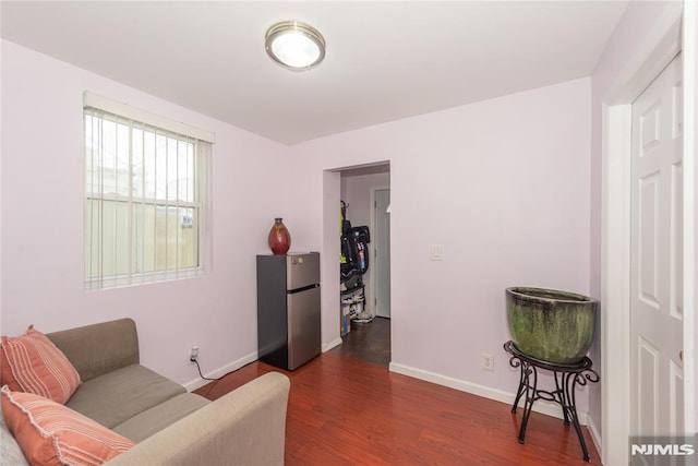 4310 Newkirk Ave, North Bergen, NJ 07047 - sitting room with dark wood-style floors and baseboards