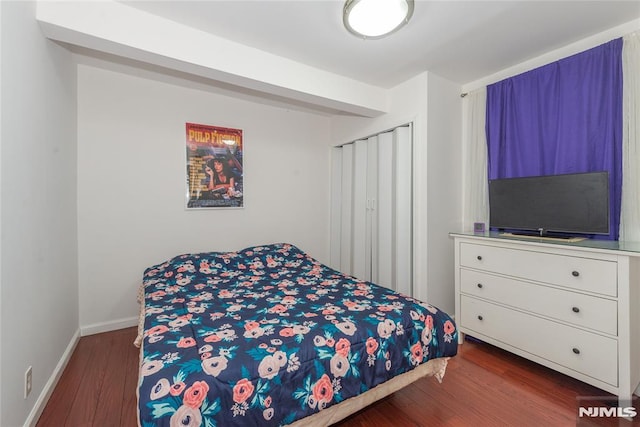 4310 Newkirk Ave, North Bergen, NJ 07047 - bedroom with dark wood-style flooring and baseboards