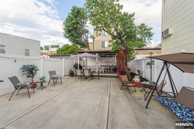 4310 Newkirk Ave, North Bergen, NJ 07047 - fenced backyard with outdoor dining area and a patio