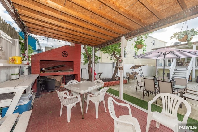 4310 Newkirk Ave, North Bergen, NJ 07047 - fenced backyard with outdoor dining space, a patio, and stairway