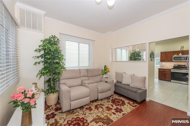 4310 Newkirk Ave, North Bergen, NJ 07047 - living room with ornamental molding and light wood-style floors