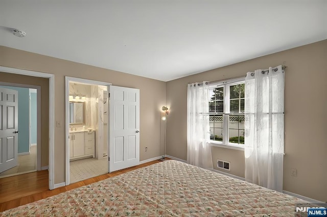 114 Summit Cross, Rutherford, NJ 07070 - bedroom with wood finished floors, baseboards, and connected bathroom