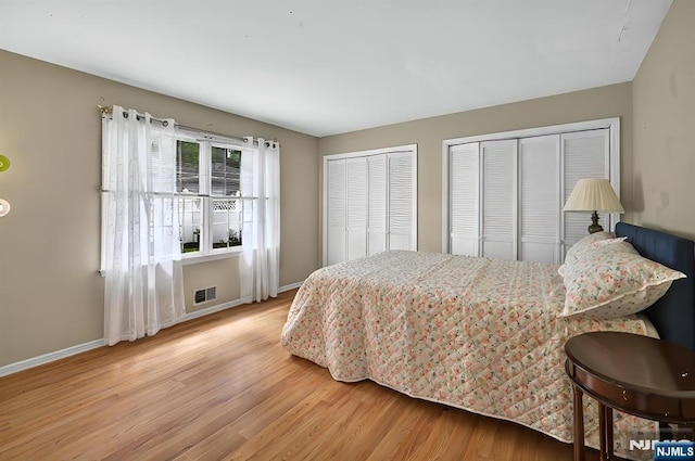 114 Summit Cross, Rutherford, NJ 07070 - bedroom with two closets, wood finished floors, and baseboards