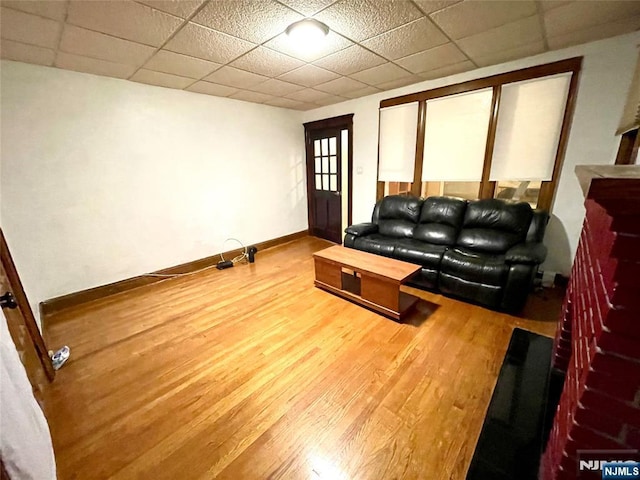 208 Wayne Ave, Cliffside Park, NJ 07010 - living area featuring wood finished floors, a paneled ceiling, and baseboards