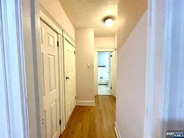208 Wayne Ave, Cliffside Park, NJ 07010 - corridor featuring wood finished floors and baseboards