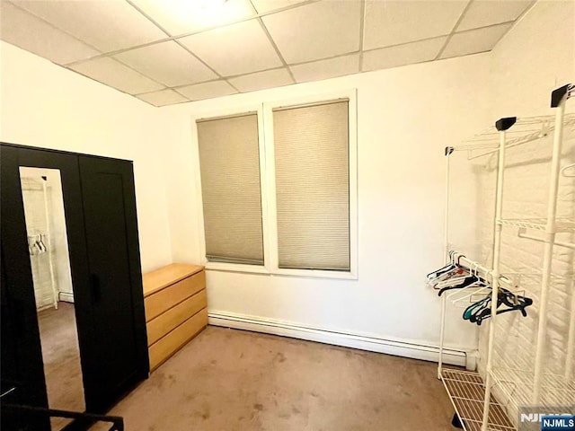 208 Wayne Ave, Cliffside Park, NJ 07010 - interior space with a paneled ceiling, a baseboard heating unit, and light colored carpet