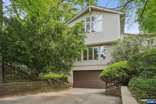 53 Sunset Ter, Wayne, NJ 07470 - view of home's exterior featuring driveway and an attached garage