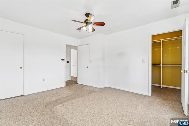 239 40th St Unit C0007, Irvington, NJ 07111 - unfurnished bedroom featuring carpet flooring, a walk in closet, baseboards, and a ceiling fan