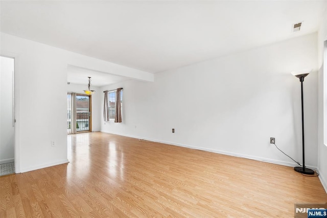 239 40th St Unit C0007, Irvington, NJ 07111 - unfurnished living room featuring light wood-type flooring and baseboards