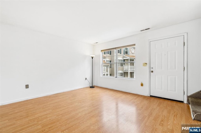 239 40th St Unit C0007, Irvington, NJ 07111 - foyer featuring light wood-type flooring and baseboards