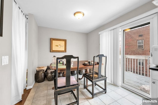 755 Jefferson Ave, Cliffside Park, NJ 07010 - dining space featuring light tile patterned floors and baseboards
