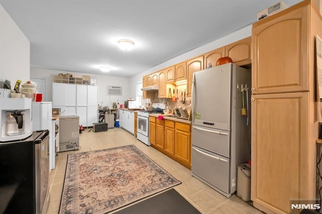 755 Jefferson Ave, Cliffside Park, NJ 07010 - kitchen featuring freestanding refrigerator, gas range gas stove, under cabinet range hood, light tile patterned flooring, and refrigerator