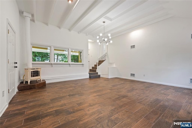 41 Oakland Ave, Westwood, NJ 07675 - unfurnished living room with a wood stove, dark wood-type flooring, a chandelier, beamed ceiling, and baseboards