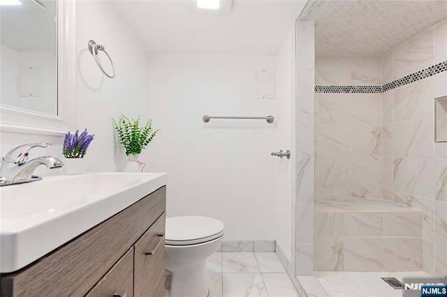 41 Oakland Ave, Westwood, NJ 07675 - full bath featuring marble finish floors, vanity, toilet, a tile shower, and baseboards