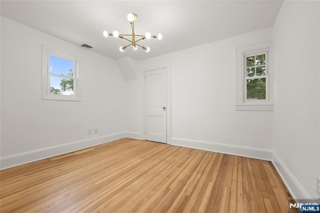 41 Oakland Ave, Westwood, NJ 07675 - spare room with a chandelier, light wood-style floors, and baseboards