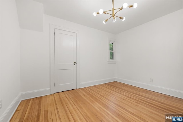 41 Oakland Ave, Westwood, NJ 07675 - unfurnished room featuring a chandelier, light wood-type flooring, and baseboards