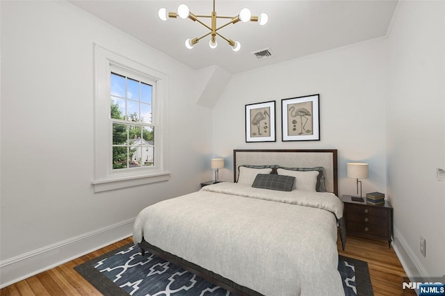 41 Oakland Ave, Westwood, NJ 07675 - bedroom with a chandelier, baseboards, wood finished floors, and crown molding