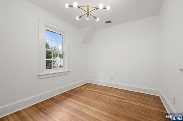 41 Oakland Ave, Westwood, NJ 07675 - unfurnished room featuring a chandelier, light wood-style floors, baseboards, and crown molding