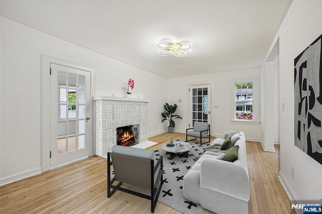 41 Oakland Ave, Westwood, NJ 07675 - living room with light wood-style floors, a fireplace, and baseboards