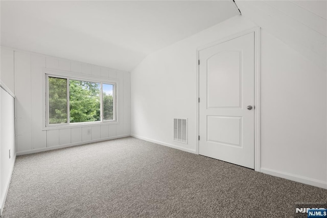 41 Oakland Ave, Westwood, NJ 07675 - carpeted empty room with lofted ceiling and baseboards