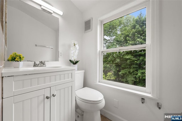 41 Oakland Ave, Westwood, NJ 07675 - bathroom featuring toilet, plenty of natural light, vanity, and baseboards