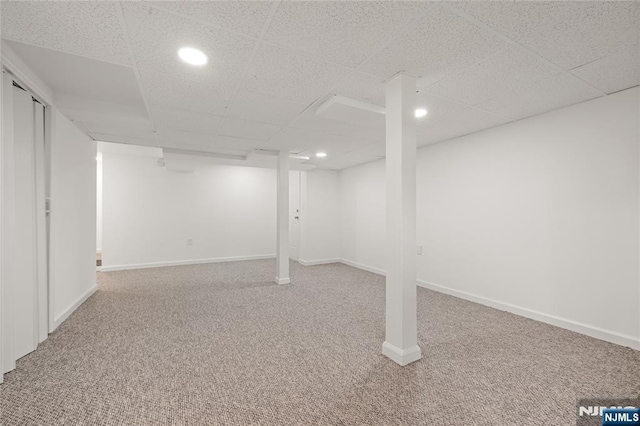 41 Oakland Ave, Westwood, NJ 07675 - finished below grade area with carpet, a drop ceiling, recessed lighting, and baseboards