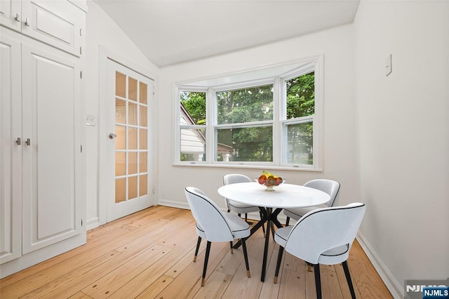 41 Oakland Ave, Westwood, NJ 07675 - dining space featuring light wood-type flooring, vaulted ceiling, and baseboards