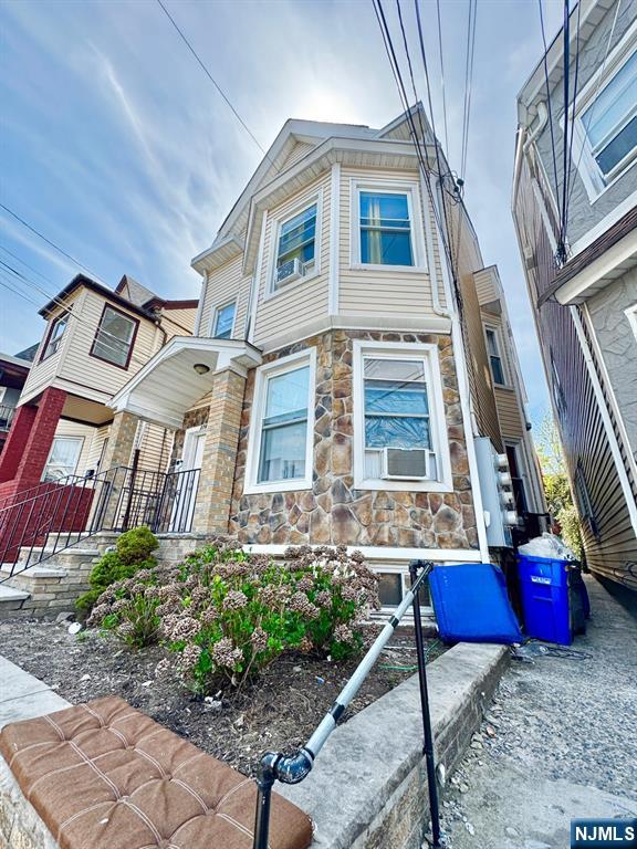 276 5th Ave, Paterson, NJ 07524 - townhome / multi-family property with stone siding