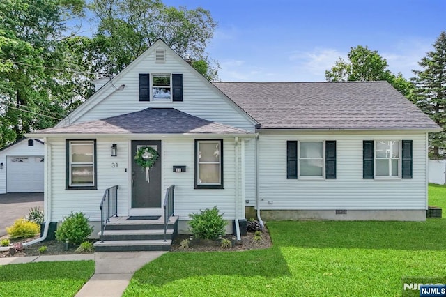 31 Andrews Pl, Pequannock Township, NJ 07444 - bungalow-style home featuring an outdoor structure, a shingled roof, a front lawn, and driveway