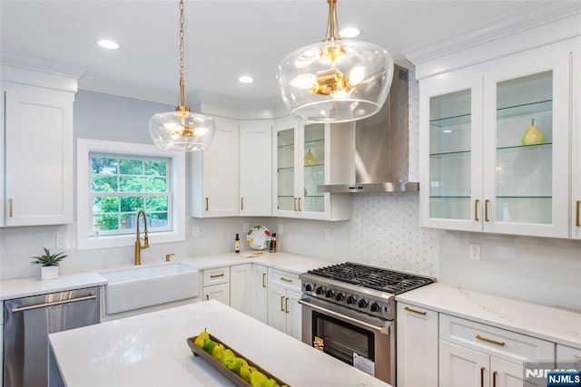 231 Ward Pl S, Orange Village, NJ 07079 - kitchen with stainless steel appliances, a sink, white cabinets, wall chimney exhaust hood, and tasteful backsplash