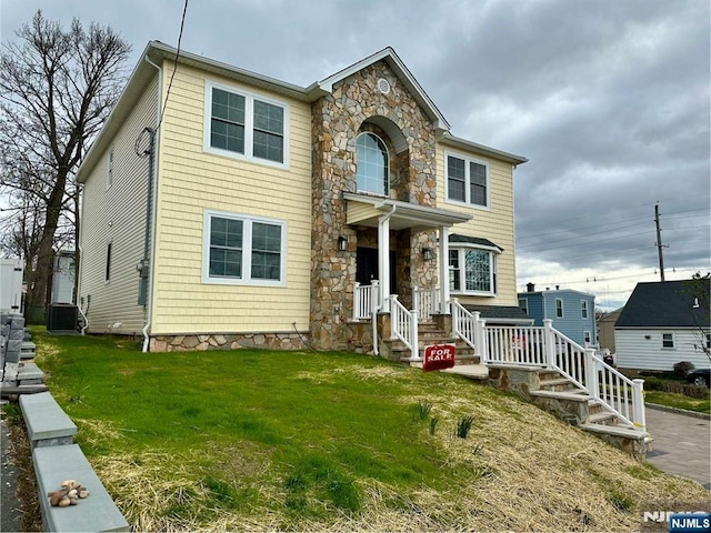 178 Leonard Pl, North Arlington, NJ 07031 - view of front of home with stone siding and a front lawn