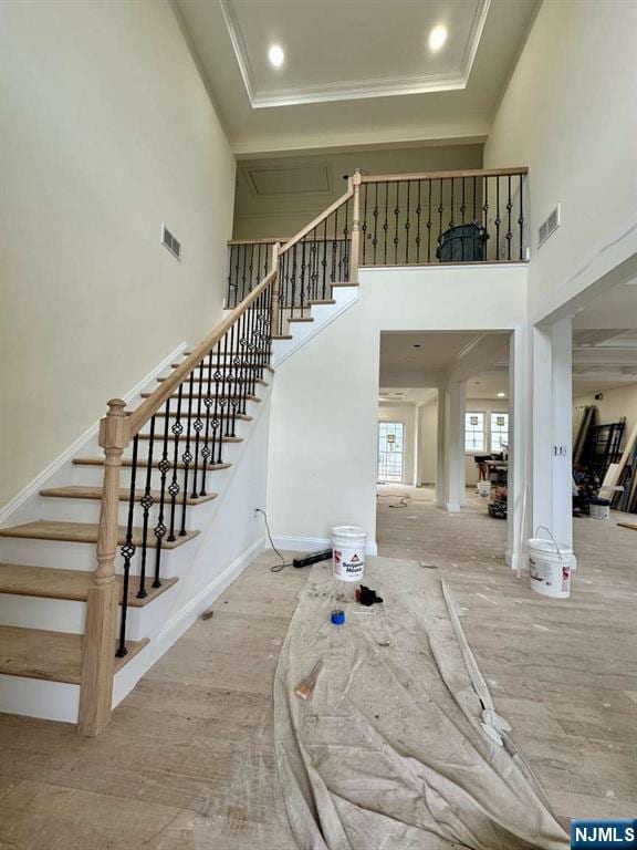178 Leonard Pl, North Arlington, NJ 07031 - stairs with a high ceiling and ornamental molding