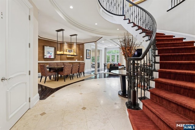 511 Bellaire Dr, Demarest, NJ 07627 - foyer with stairway, baseboards, recessed lighting, decorative columns, and crown molding