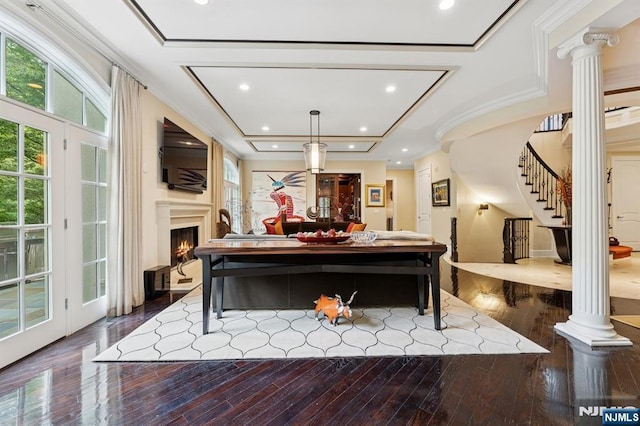 511 Bellaire Dr, Demarest, NJ 07627 - living room with ornate columns, stairs, healthy amount of natural light, dark wood finished floors, and crown molding