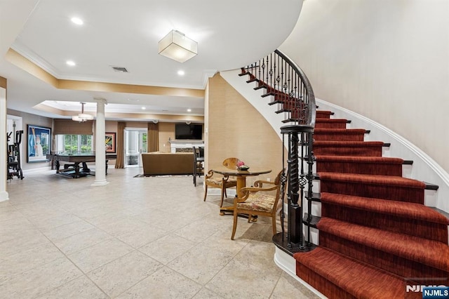 511 Bellaire Dr, Demarest, NJ 07627 - staircase featuring decorative columns, crown molding, baseboards, a tray ceiling, and recessed lighting