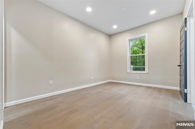 99 W 50th St, Bayonne, NJ 07002 - spare room featuring baseboards, recessed lighting, and light wood-style floors