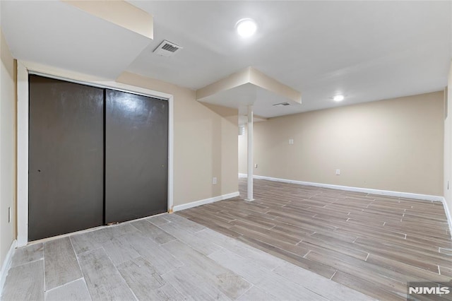 99 W 50th St, Bayonne, NJ 07002 - unfurnished bedroom with light wood-style floors, baseboards, a closet, and recessed lighting