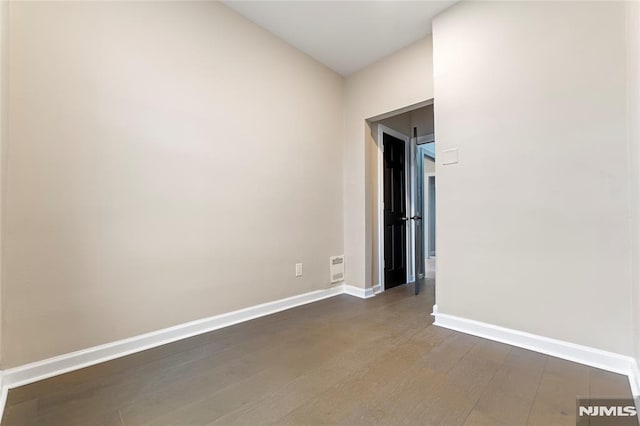 99 W 50th St, Bayonne, NJ 07002 - empty room with baseboards and dark wood-style flooring