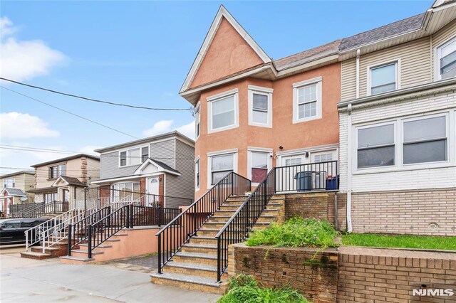 99 W 50th St, Bayonne, NJ 07002 - multi unit property with brick siding and stairway