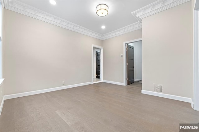 99 W 50th St, Bayonne, NJ 07002 - unfurnished room featuring crown molding, baseboards, wood finished floors, and recessed lighting