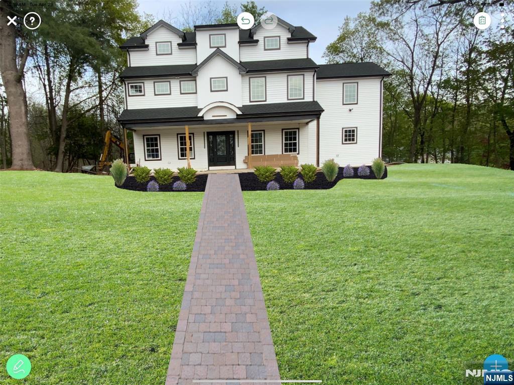 286 Squaw Brook Rd, North Haledon, NJ 07508 - view of front of house featuring a porch and a front yard
