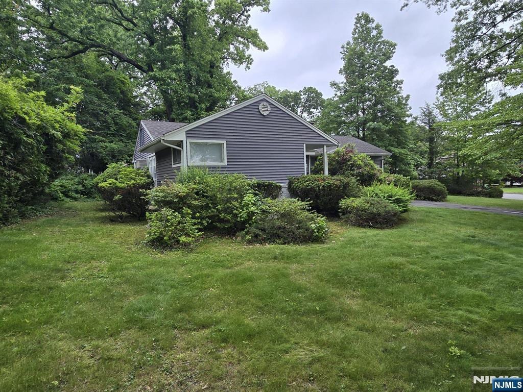195 Concord Dr, Paramus, NJ 07652 - view of side of property with a lawn