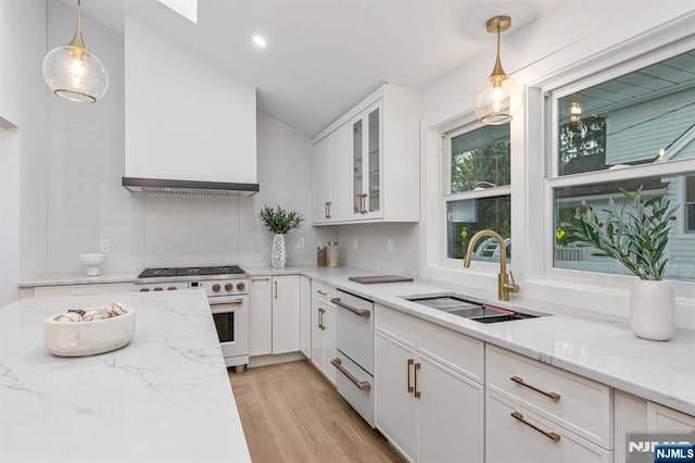 82 Cooper Ave, Montclair, NJ 07043 - kitchen with gas range oven, a sink, lofted ceiling, white cabinets, and dishwasher