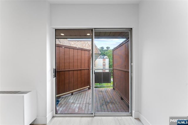 1111 River Rd Unit F25, Edgewater, NJ 07020 - doorway with baseboards and wood finished floors